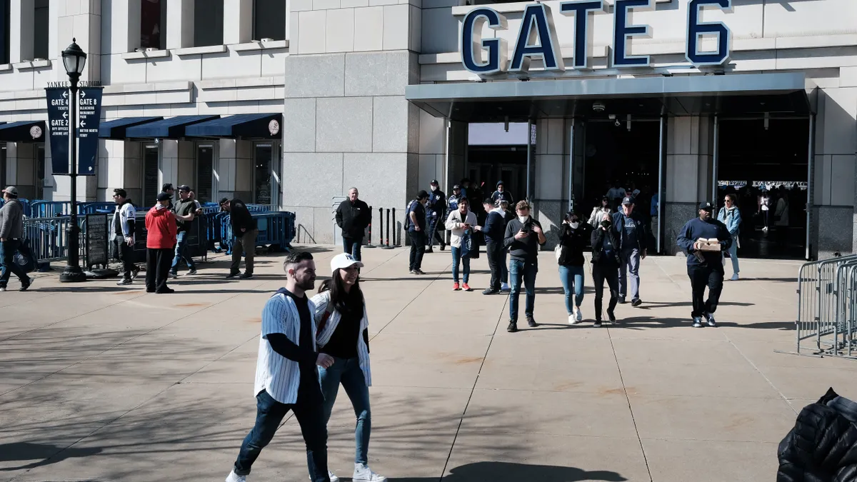 Fans walk outside Yankee Stadium