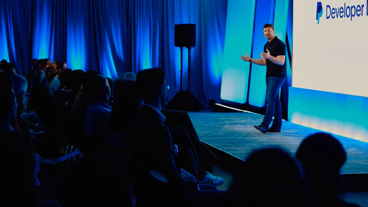 PayPal CEO Alex Chriss presenting a new merchant service.