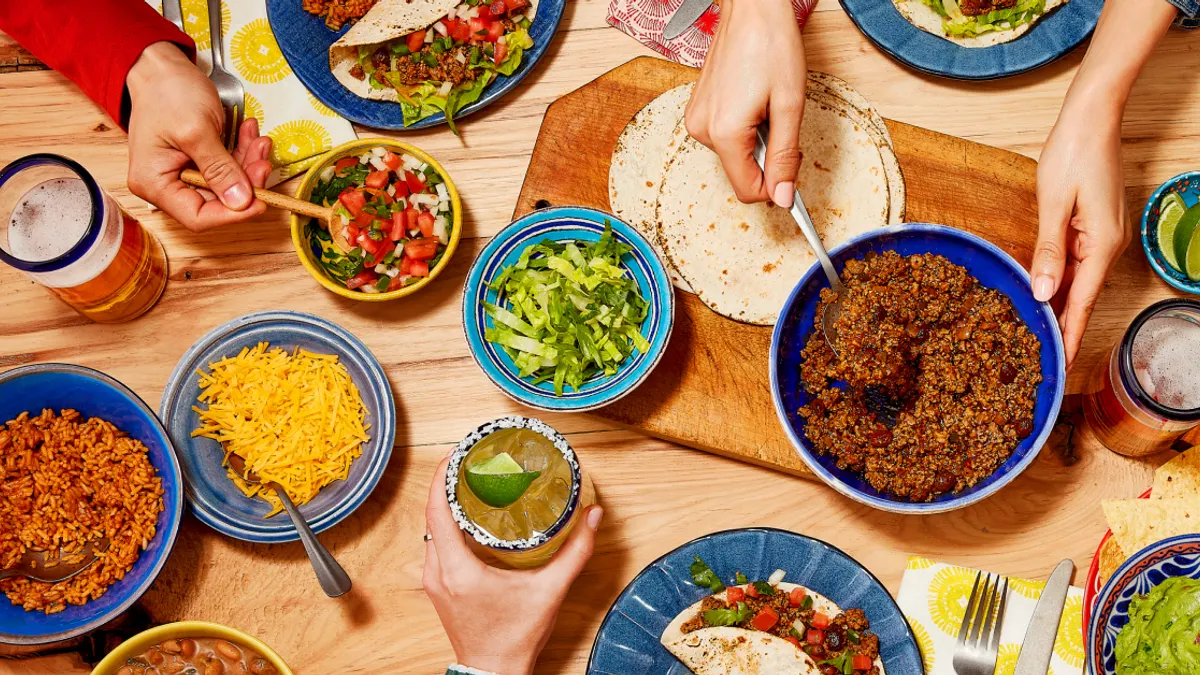 Table full of all the things to make tacos at home