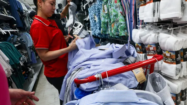 A worker prices items at a retail store on July 15, 2025, in New York City.