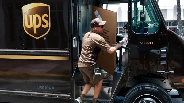 A UPS driver makes a delivery on June 30, 2023 in Miami, Florida.