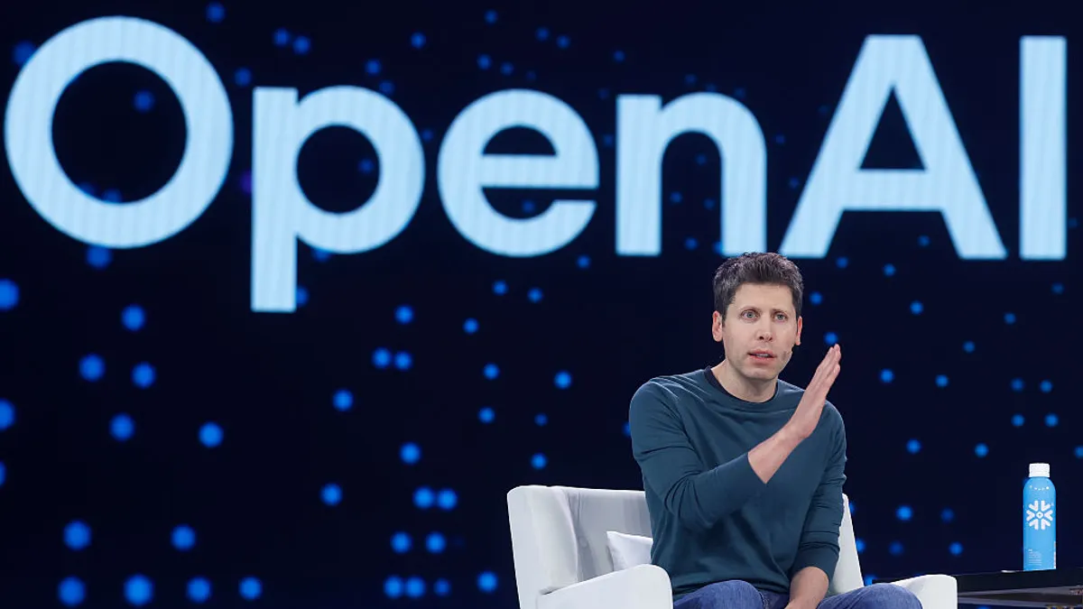 Sam Altman speaks in a conference setting