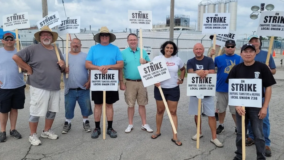 Striking members of Teamsters Local 238 and state and local government officials on the picket line outside of the Amcor facility in Des Moines, Iowa, on Aug. 4, 2023.