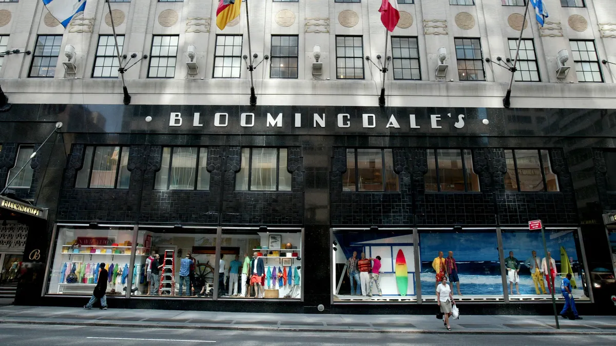 An exterior daytime shot of a large department store on a city street.