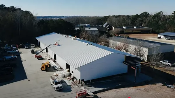An overhead view of a warehouse under construction.