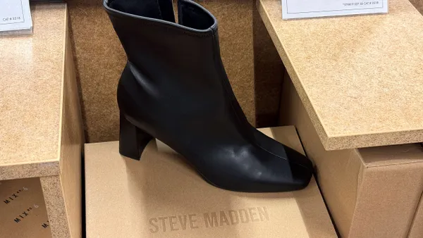 A Steve Madden boot on display at a store.