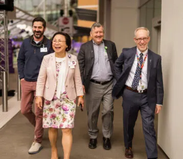 A group of people including Florence Chang and William Robertson walking together.