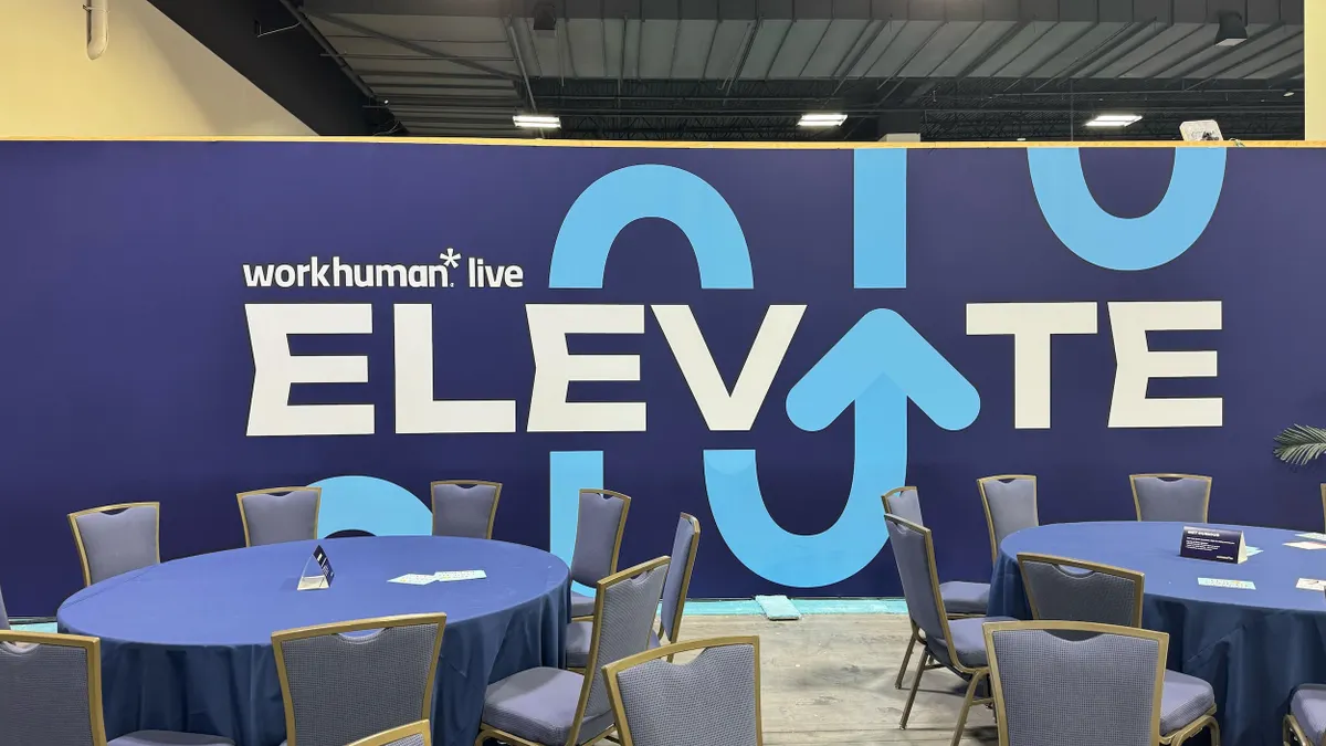 A sign that says Elevate at the conference hall for Workhuman Live 2025.