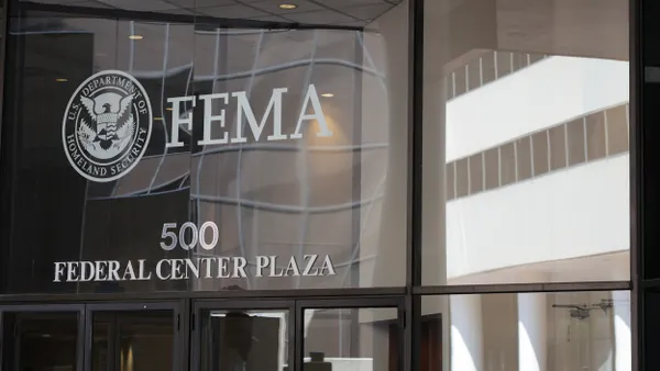 Glass building wall with U.S. Department of Homeland Security seal and the words FEMA, 500 Federal Center Plaza
