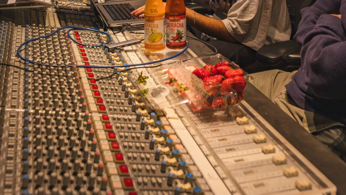 Campaign imagery for Lee Kum Kee's campaign centered around music showcases individuals in a recording studio with the marketer's sauces on display.