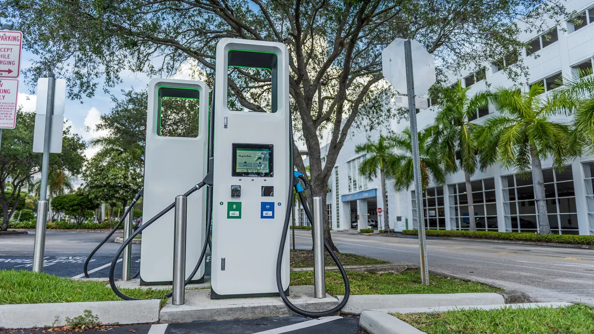 An EV charging station in an office building parking lot.