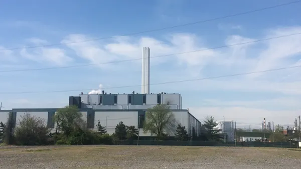 An industrial facility with a smokestack
