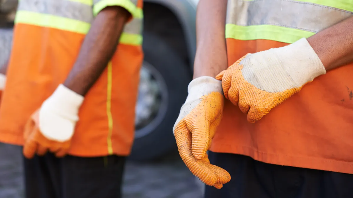 Cropped shot of a team of garbage collectors