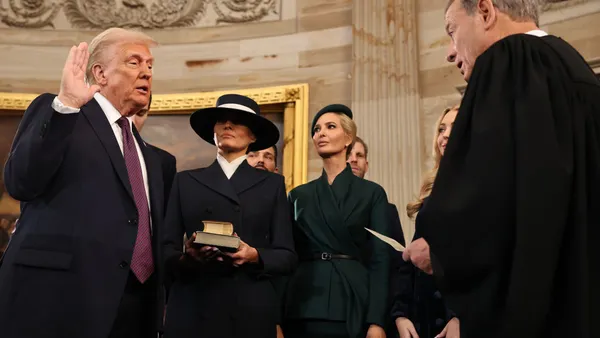 Donald Trump takes oath of office before Chief Justice John Roberts in the U.S. Capitol Rotunda