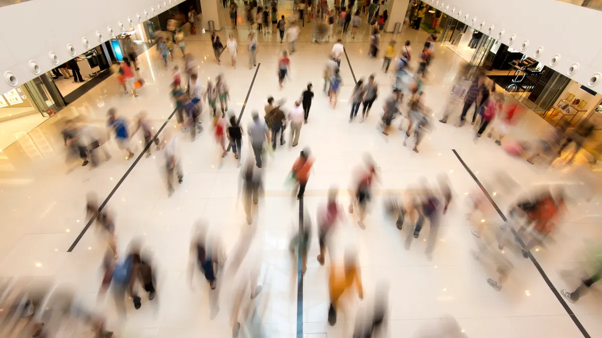 The interior of a busy shopping mall.