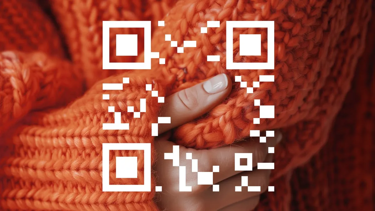 An orange sweater with an overlay of a QR code