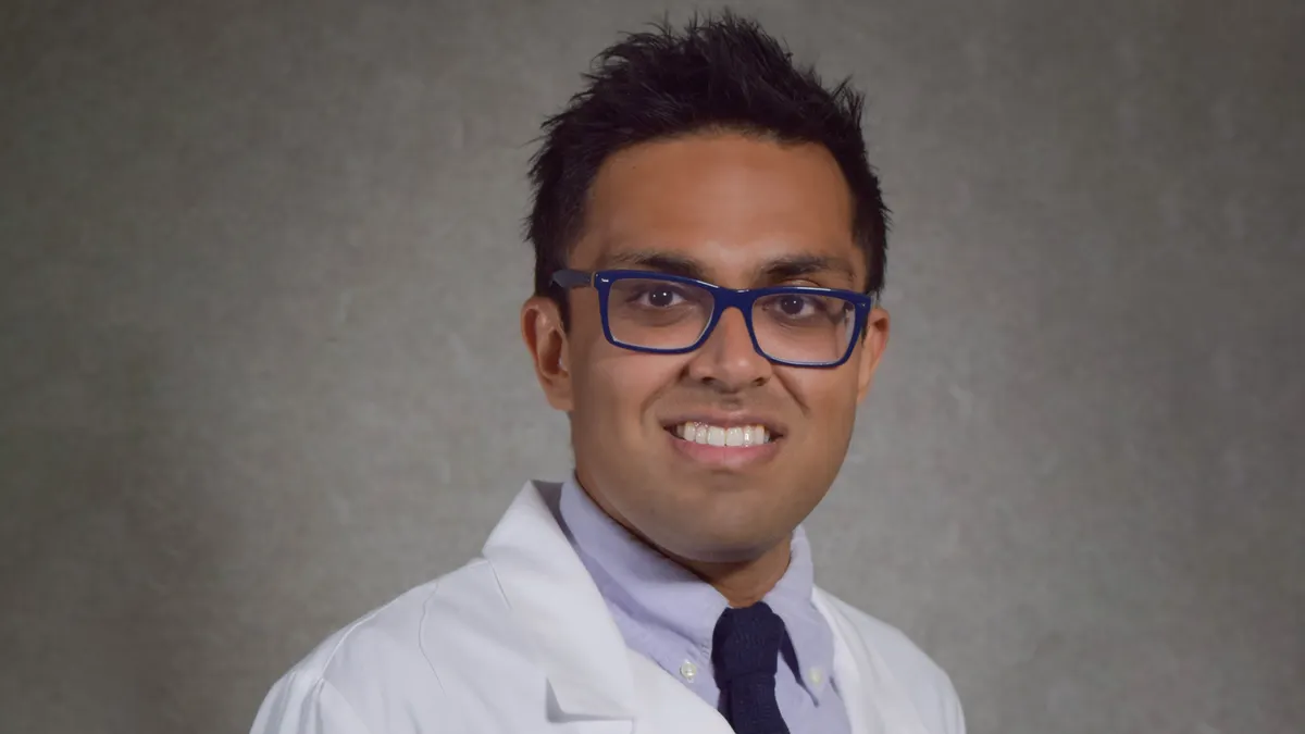 A headshot of Ali Khan, CMO of Oak Street Health