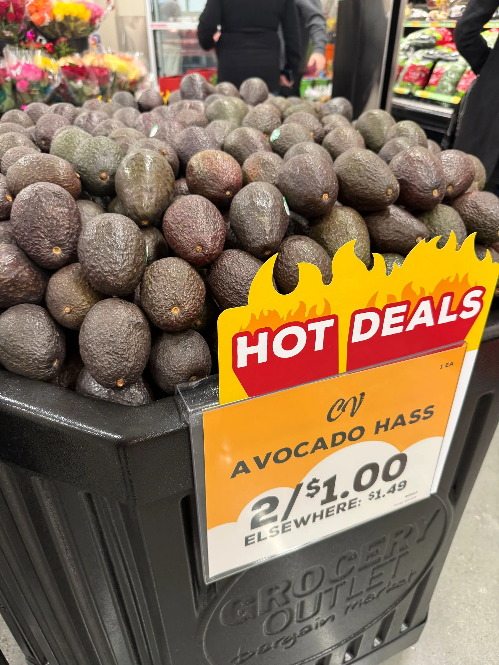 Avocado display at a grocery store.