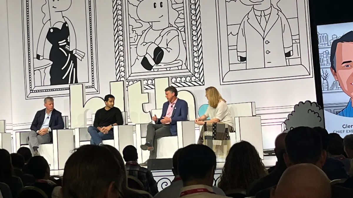 Panelists onstage at HLTH22.
