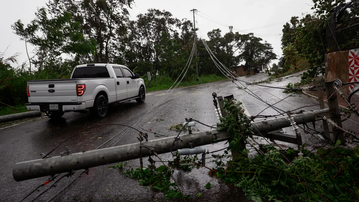 A downed power line on a street in Puerto Rico after Hurricane Fiona hit the island.