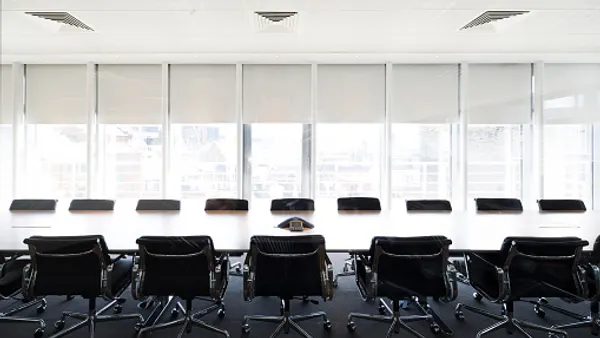 Empty boardroom meeting space in office
