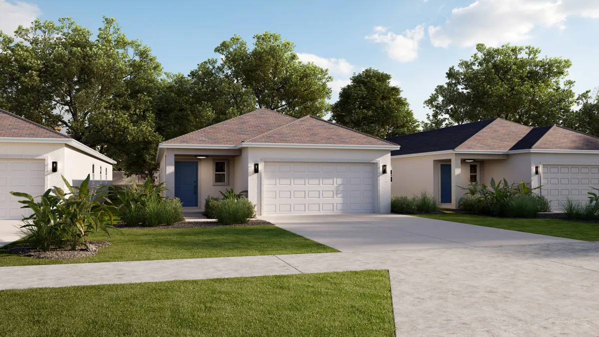 Light colored, detached home with sidewalk, driveway and grass in the foreground.