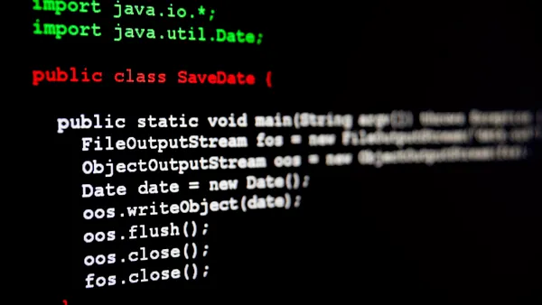 Generic java programming code written on black.