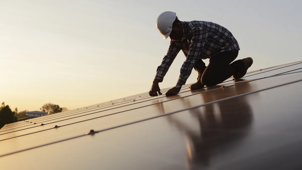 Engineer working on checking and maintenance equipment at industry solar power.