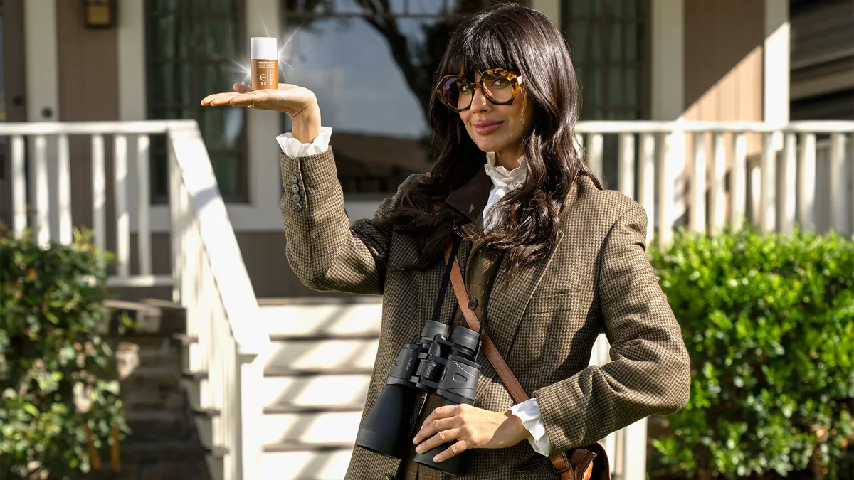 Jameela Jamil poses as an anthropologist for E.l.f. Cosmetics' "Peculiar Behavior" campaign promoting its new Bronzing Drops.