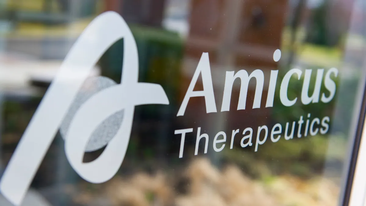 A window with the logo for Amicus Therapeutics.