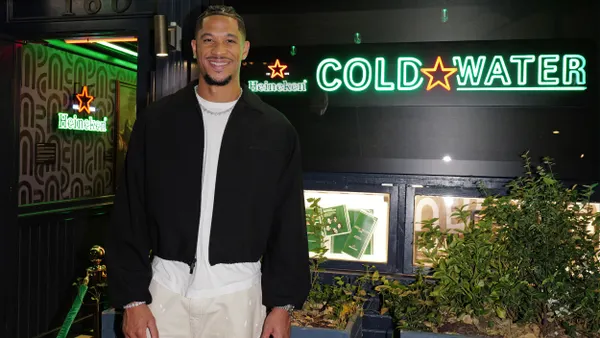 Josh Hart stands in front of the Cold Water Bar.