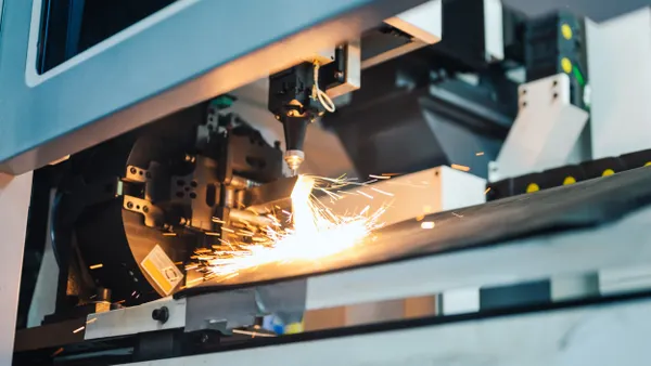 Sparks come off an industrial machine in a factory