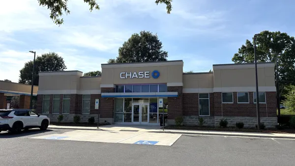 A stone and brick building is shown with the "Chase" name and logo on the exterior. A white car is parked nearby.
