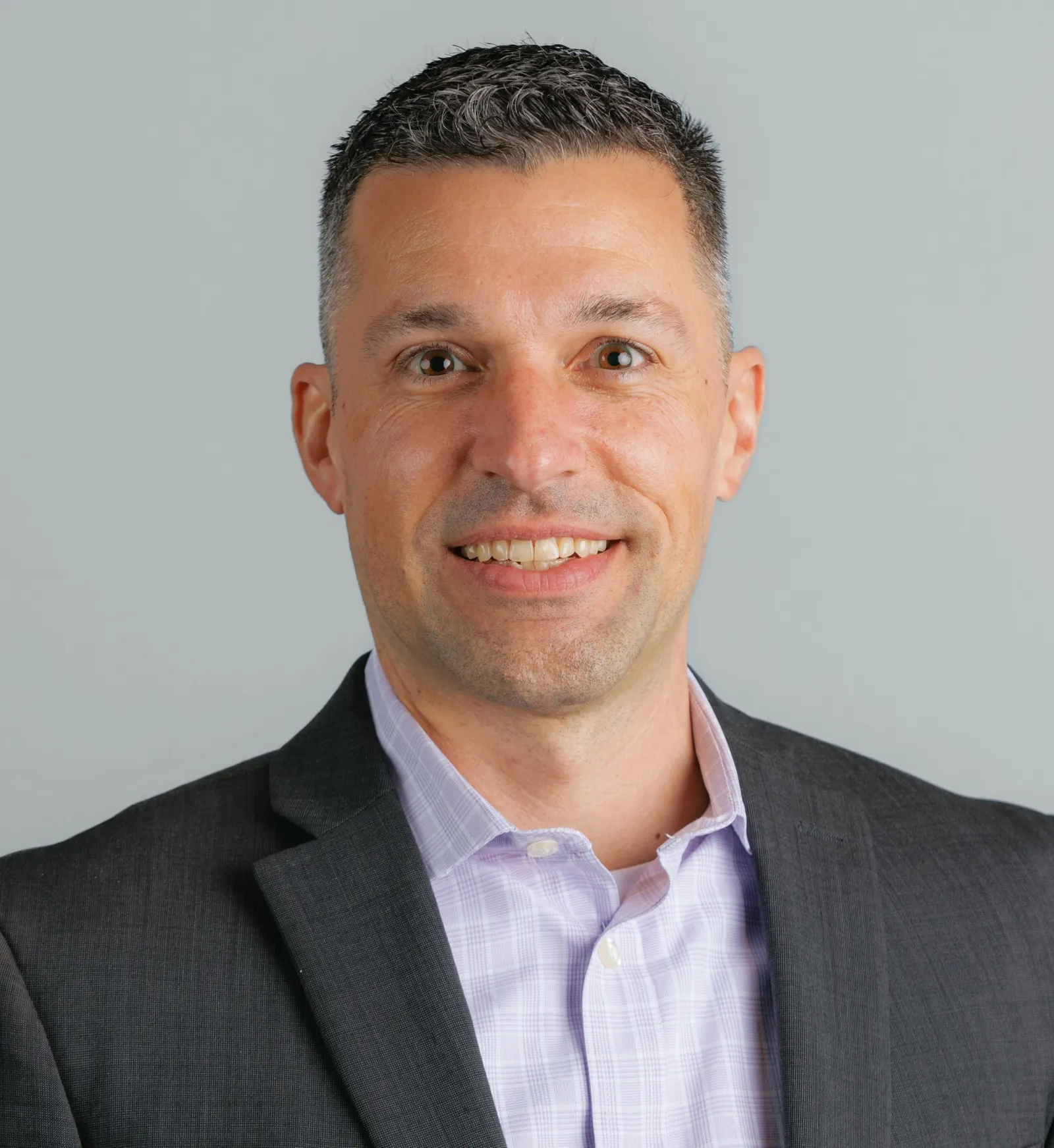 Headshot of a man in a suit