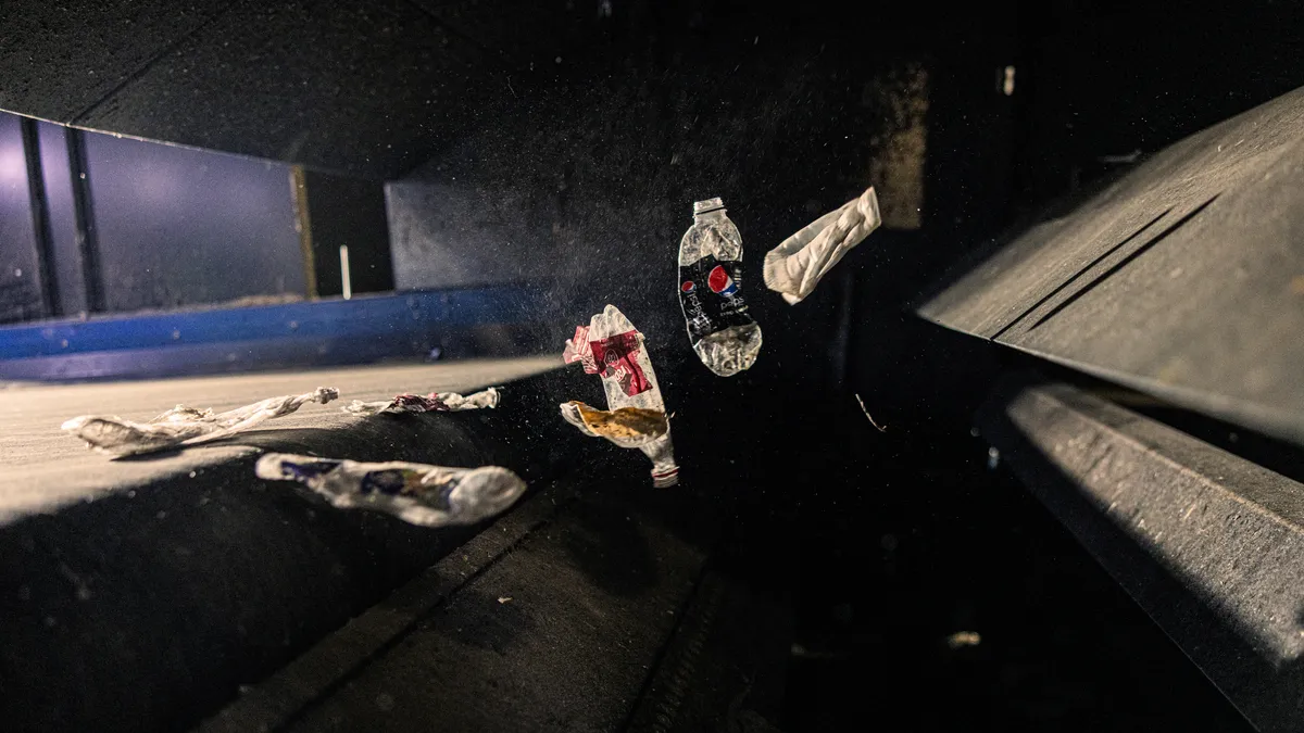 A plastic bottle moves through an AMP sorter