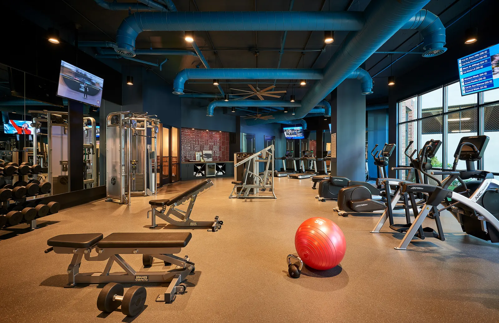 A fitness center with workout equipment.