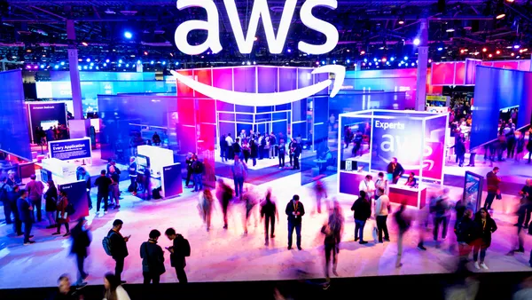 Attendees walk through an expo hall at AWS re:Invent 2023, a conference hosted by Amazon Web Services, at The Venetian Las Vegas on November 28, 2023 in Las Vegas, Nevada.