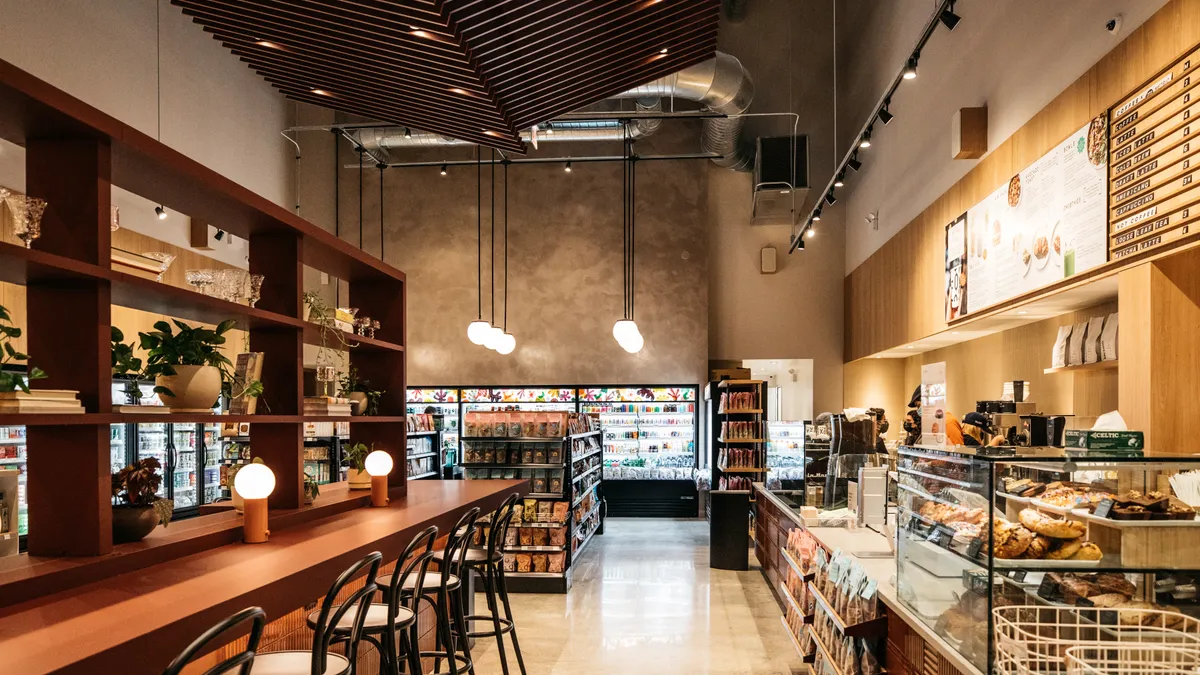 Interior image of a Foxtrot market with pastry bar and pantry shelves