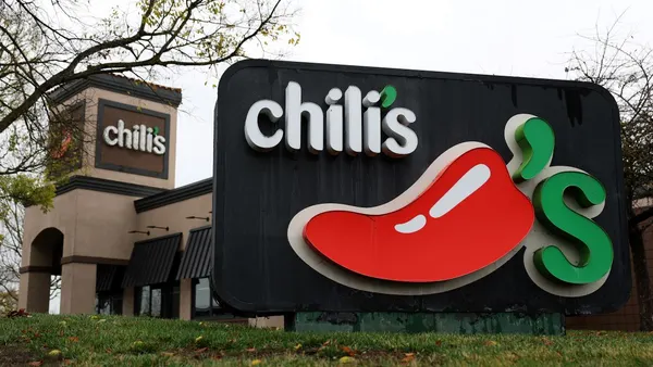 An image of a Chili's sign with a red chili pepper.