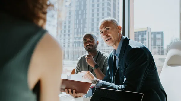 Executive Team Discussion During Strategic Business Meeting