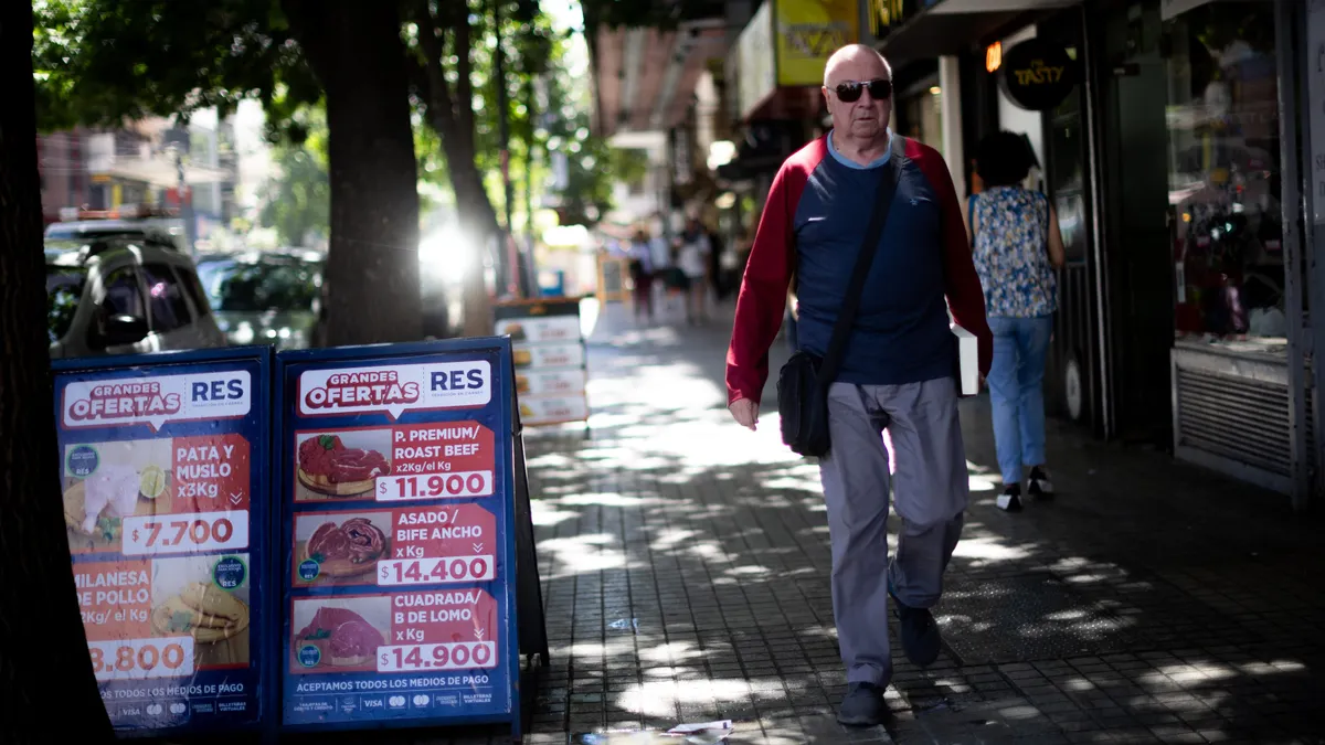 Fiserv Argentina payments processing currency inflation