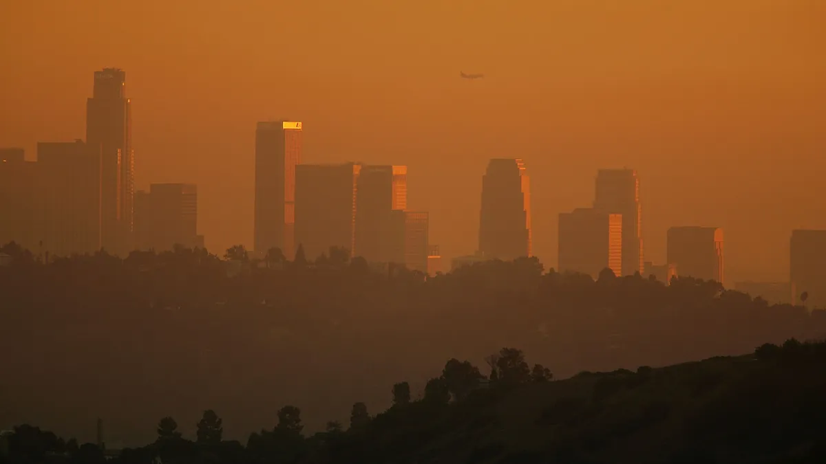 Los Angeles's downtown skyline enveloped in smog.