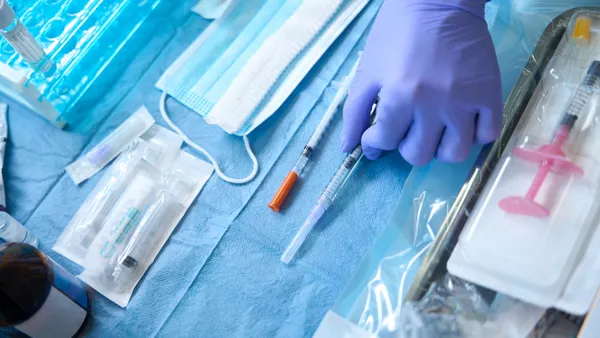 Medical instruments being prepared for a procedure.