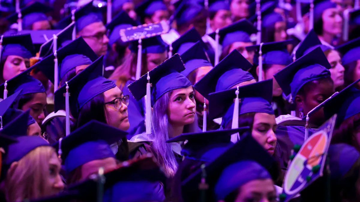 Hunter College students at a graduation ceremony.