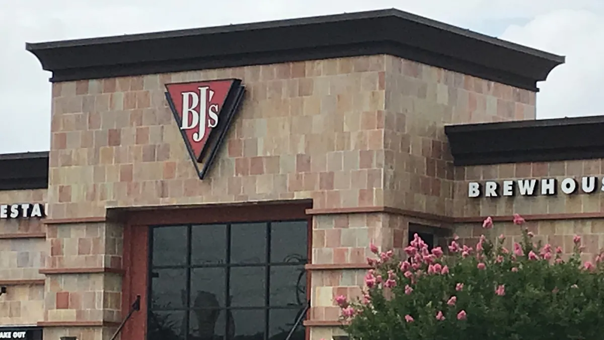 An image of an orange building with a logo that says BJ's