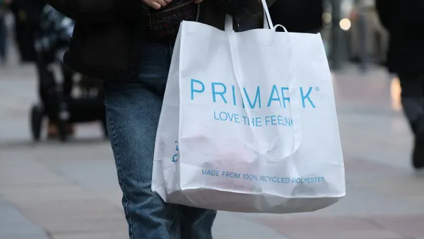 A person carries a shopping bag of Primark discount fashion on December 13, 2024 in Berlin, Germany.