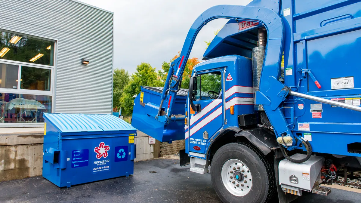 Republic Services truck collecting a container