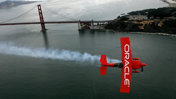 Stunt pilot Sean Tucker flies his Team Oracle biplane near the Golden Gate Bridge as he practices for the 2006 San Francisco fleet week October 5, 2006 in San Francisco.