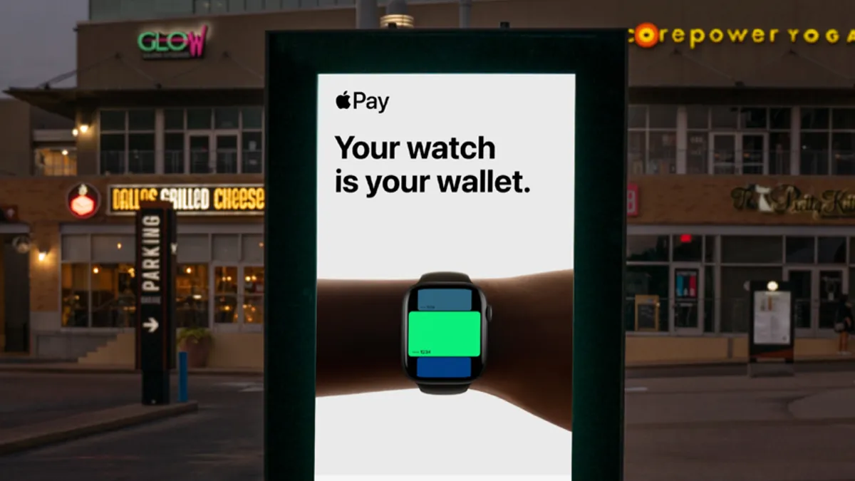 A digital OOH advertisement for Apple's "Pay The Apple Way" campaign.