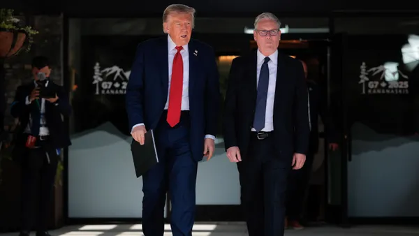 President Donald Trump walks alongside British Prime Minister Keir Starmar during the G7 Leaders' Summit on June 16, 2025, in Kananaskis, Alberta.